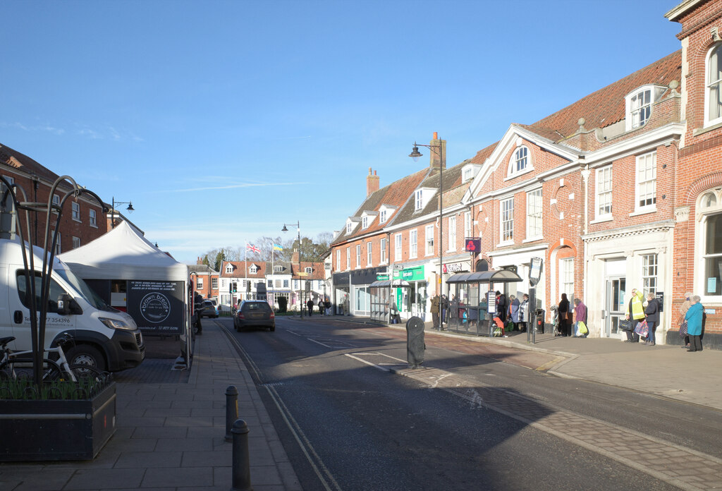 Dereham market place at the heart of Norfolk, with shoppers and stalls